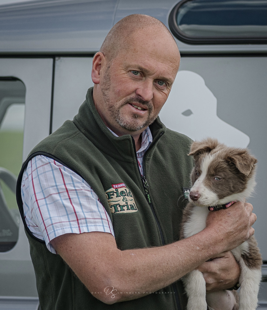 Damian Barson holding new pup Lassie.