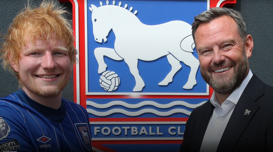 ed Sheeran with ITFC chairman Mark Ashton standing in front of ITFC sign