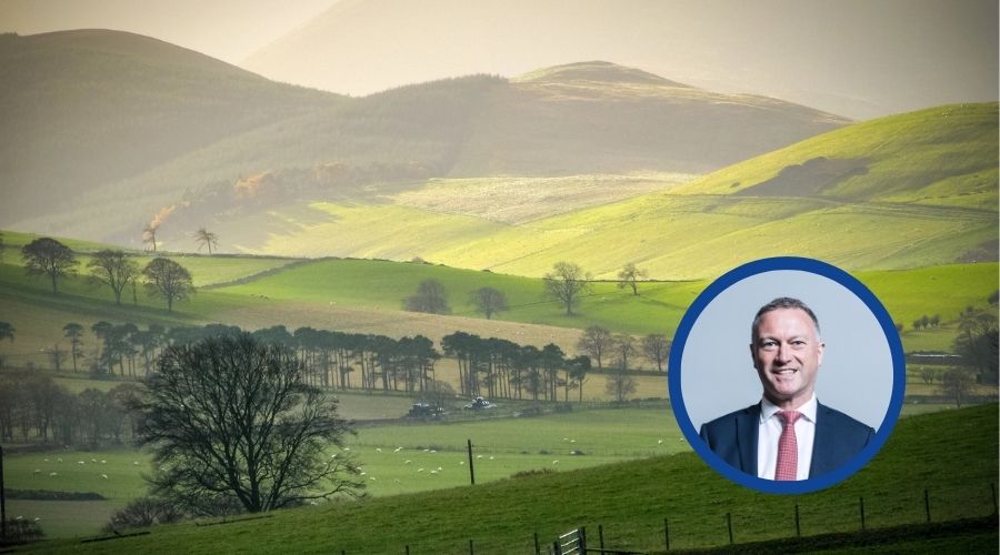 rural farm scene, with picture of Steve Reed in a circle overlaid on main image