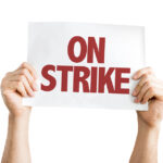 stock photo sign that reads 'on strike'