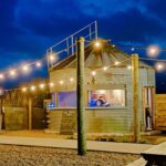 The owners of a Suffolk campsite, Pigs in Blankets, had an unusual idea to turn an old grain silo into a bar, The Grain Shed.