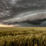 storm clouds over crop field