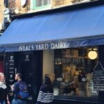 A man was arrested after over 950 wheels of cheddar, worth £300,000, was stolen from a London artisanal cheese maker, Neal’s Yard Dairy.