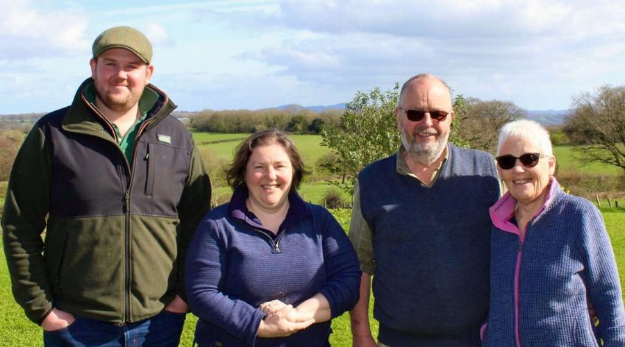 David and Janet Legge (right), with their daughter Gina and grandson James Legge, with a field in the background