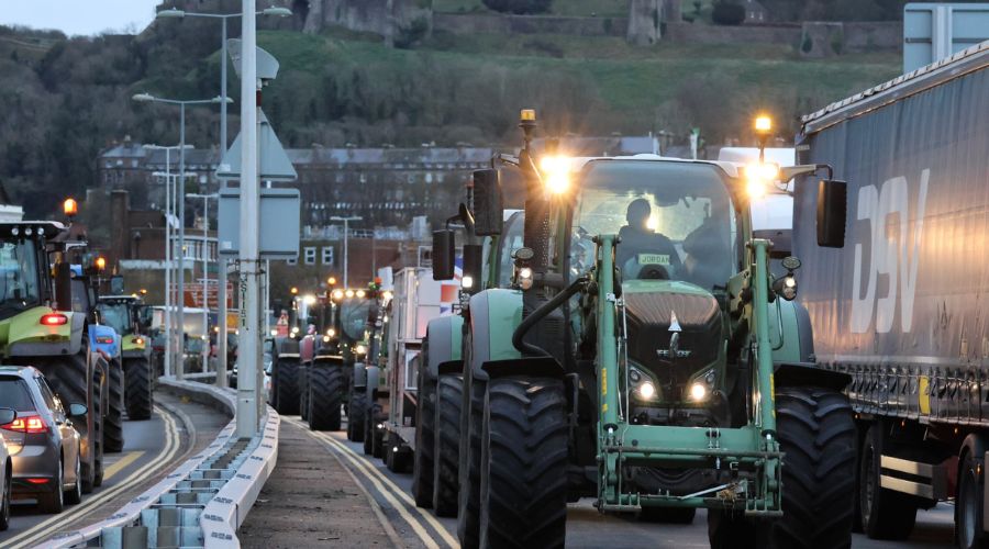 lines of tractors driving through streets of Dover