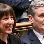 chancellor Rachel Reeves laughing and sitting next to keir starmer in the House of Commons