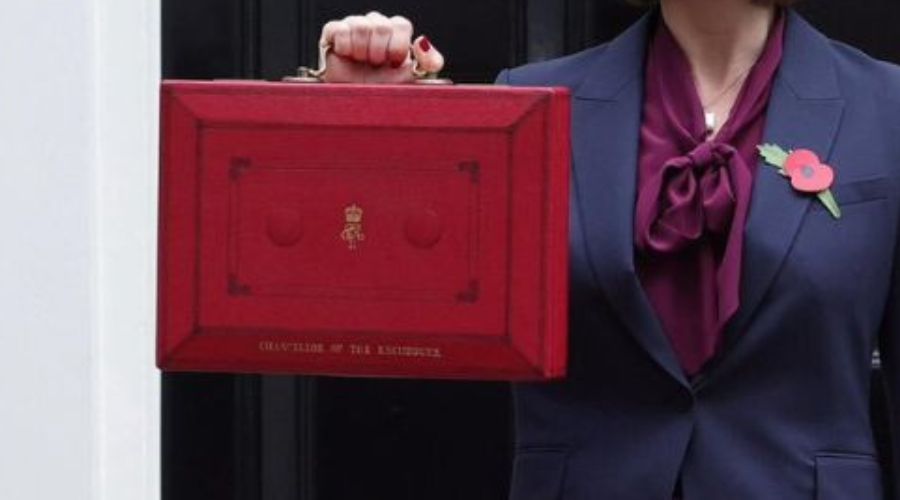 close up of chancellor holding red briefcase for autumn budget 