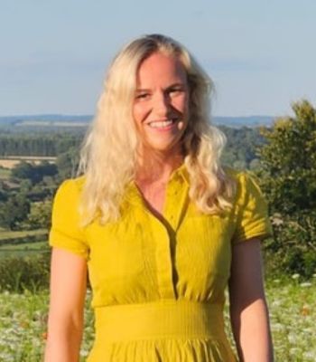 Emma Mosey, chair of Farm Retail Association - blonde woman in a yellow dress standing in a field