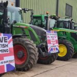 tractors lined up at a protest with save British farming signs