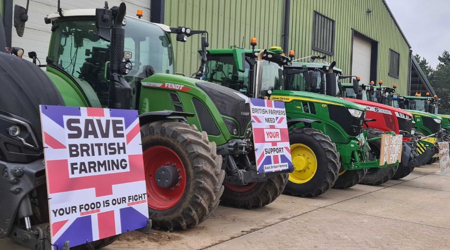 tractors lined up at a protest with save British farming signs