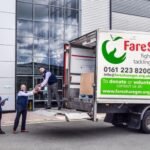 people loading food parcels into a FareShare van