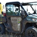 can am vehicle in a field with ACS decal