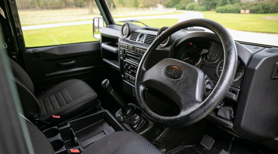 interior view of Defender 90's steering wheel and dashboard 