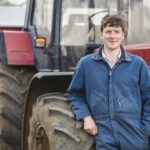 Farmer Jon Watt leaning on Case IH tractor