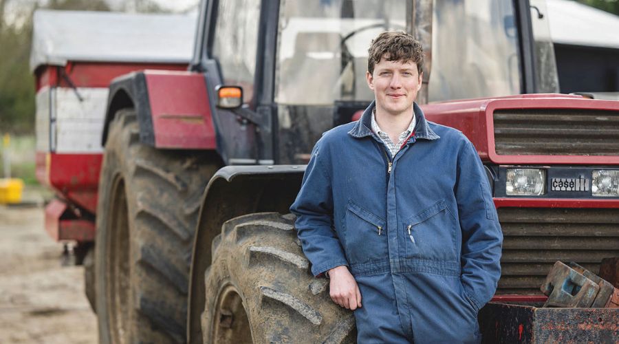 Farmer Jon Watt leaning on Case IH tractor