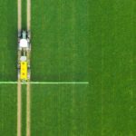 Ascenso tyres on tractor pulling trailed sprayer in farmer's field