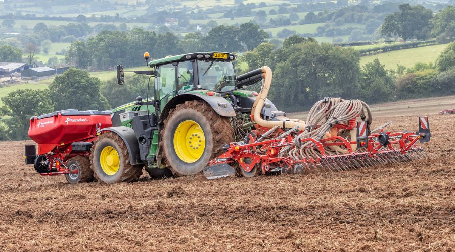 Kverneland f-drill tank and Rotago power harrow attached to tractor