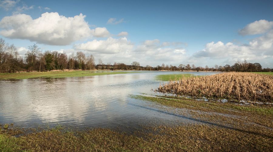 Homes, businesses and farmland will be protected from impacts of flooding and climate change thanks to a £2.65 billion investment, Defra said.