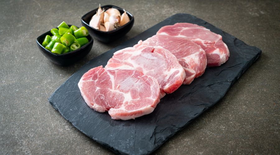 pork chops on a chopping board