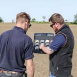 Farmers looking at data of field