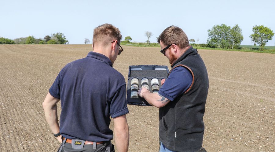 Farmers looking at data of field