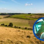 picture of a farm with cut out of farmer tom